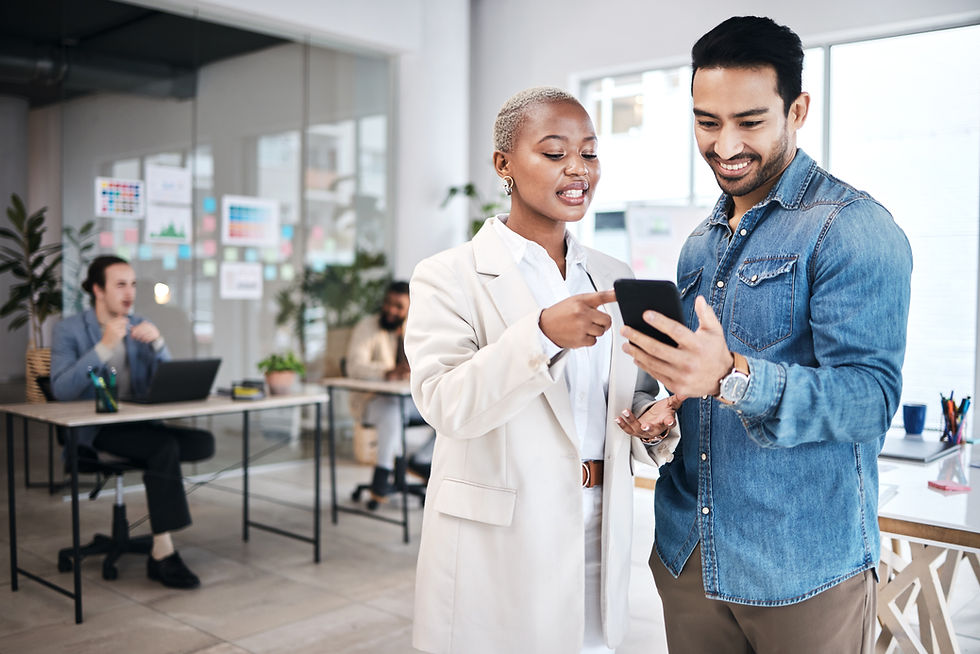 Woman showing a man something on her phone at work